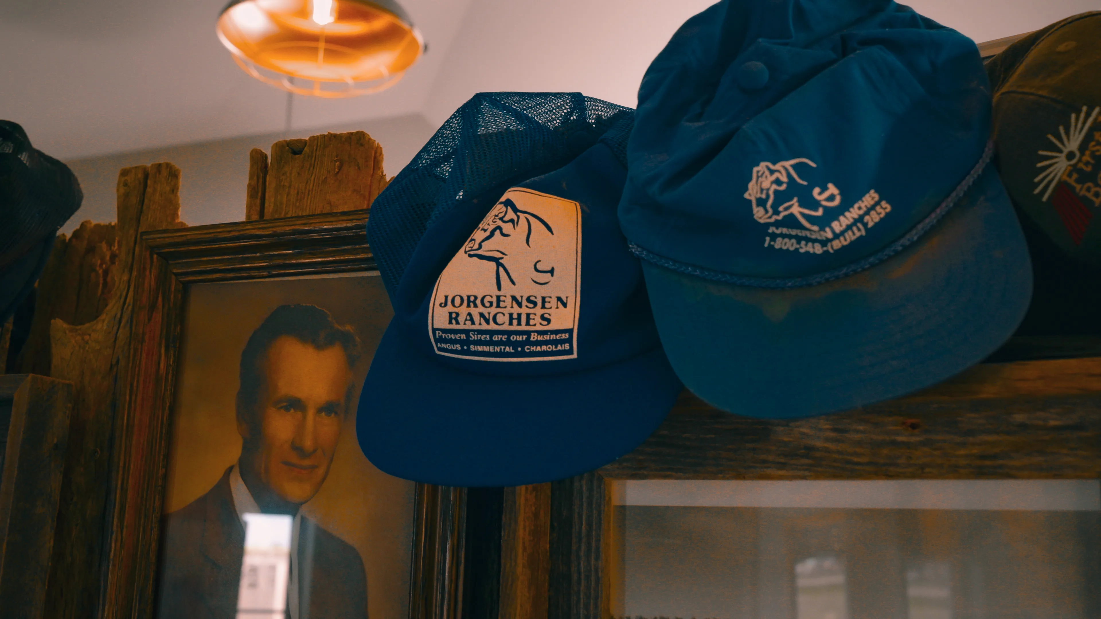 Jorgensen Ranches caps and a family portrait in the lodge