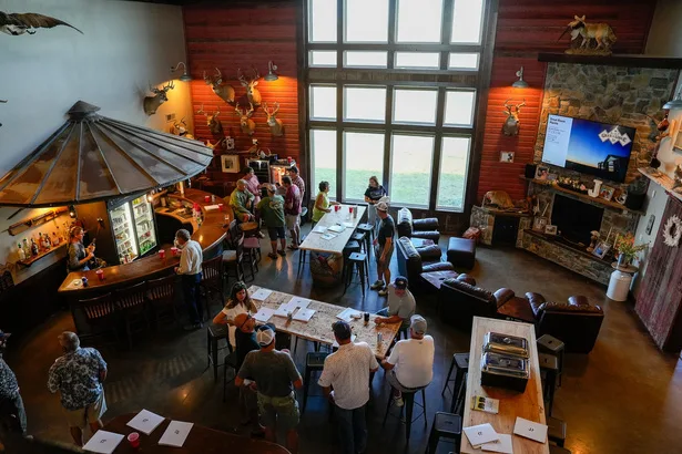 Members gathered at the lodge great room and bar